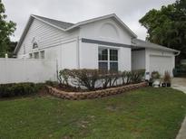 Charming one-story home with a well-manicured lawn and a two-car garage at 362 White Marsh Cir, Orlando, FL 32824