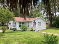 Charming single-story home with a well-manicured lawn and a welcoming front entrance at 578 3Rd St, Daytona Beach, FL 32117