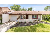 Charming home with a well-maintained front yard and inviting curb appeal at 102 Sand Pine Cir, Sanford, FL 32773