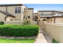 Charming townhouse with a private gated entrance and beautifully maintained landscaping at 1529 Farrindon Cir, Lake Mary, FL 32746
