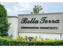 Bella Terra Condominium Community sign with attractive landscaping in a well-maintained neighborhood at 2525 Maitland Crossing Way # 202, Orlando, FL 32810