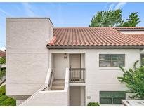 Charming condo featuring a red tile roof, white exterior, and well-maintained facade at 260 Killarney Bay Ct # 6-6, Winter Park, FL 32789