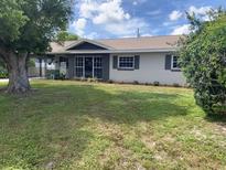 Charming single-story home with well-maintained lawn and cozy curb appeal and welcoming landscaped yard at 2648 Amsden Rd, Winter Park, FL 32792