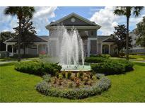 Beautiful apartment complex exterior with landscaping and fountain at 3176 Feltrim Pl # 302, Kissimmee, FL 34747