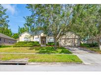 Charming single-story home with lush landscaping and a well-manicured front yard at 3954 Old Dunn Rd, Apopka, FL 32712