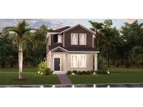 Charming two-story home featuring a well-maintained front yard and classic architectural details at 2458 Peace Of Mind Ave, Kissimmee, FL 34744