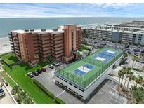 Coastal condo building showcasing the ocean view and rooftop tennis courts at 4141 S Atlantic Ave # 707, New Smyrna Beach, FL 32169