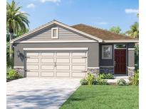 Charming single-story home with a neutral color scheme and well-manicured landscaping at 5718 Somerset Dr, Haines City, FL 33844