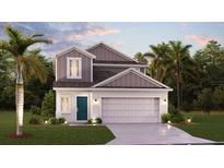 Charming two-story home featuring manicured landscaping and a two-car garage at 7881 Marlow Pl, Kissimmee, FL 34746