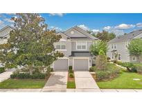 Beautiful two-story townhome with manicured landscaping and two-car garage at 976 Rock Harbor Ave, Orlando, FL 32828