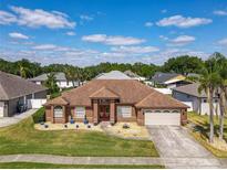 Lovely home with a well-manicured lawn, mature trees and long driveway at 2558 Ballard Ave, Orlando, FL 32833
