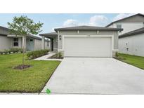 Charming single-story home with a two-car garage and a well-manicured lawn at 2778 Virginia Pine Dr, Bartow, FL 33830