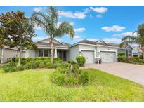 Charming single-story home with manicured landscaping and a two-car garage, perfect for suburban living at 31961 Redtail Reserve Blvd, Sorrento, FL 32776