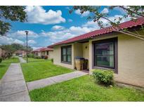 Charming single-story home with a red tile roof and well-maintained front lawn at 513 Hunter Cir # 513, Kissimmee, FL 34758