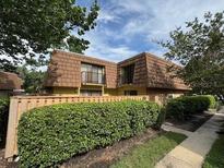 Charming townhouse featuring unique architecture and mature landscaping at 5327 Bamboo Ct # 426, Orlando, FL 32811