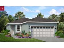 Charming single-story home with a two-car garage, well-manicured lawn, and colorful landscaping at 1194 Atlantic Ave, Fruitland Park, FL 34731