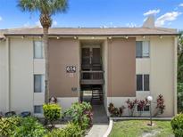 Well-maintained condo building with palm trees and nicely manicured landscaping at 614 Orange Dr # 196, Altamonte Springs, FL 32701