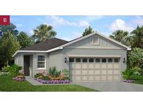 Charming one-story home featuring a spacious two-car garage and inviting, well-maintained landscaping at 746 Lemon Ave, Fruitland Park, FL 34731