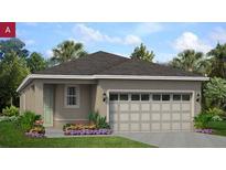 Charming single-story home with a well-manicured lawn and a two-car garage at 754 Lemon Ave, Fruitland Park, FL 34731