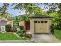 Charming single-story home featuring a well-maintained lawn and an attached two-car garage at 4018 August Ct, Casselberry, FL 32707