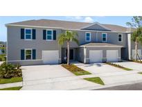 Charming townhome with a well-manicured lawn, a private garage and an inviting entrance at 2722 Golden Trout Ln, Edgewater, FL 32141