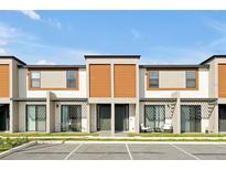 Modern townhome features neutral tones, complementary accents, and a comfortable patio space at 3308 Tranquil Trl, Kissimmee, FL 34747