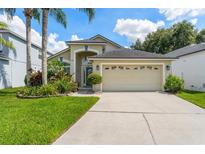 Charming single-Gathering home featuring a two-car garage and well-manicured landscaping at 462 Lakepark Trl, Oviedo, FL 32765