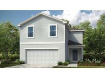 Charming two-story home features a convenient two-car garage and classic architectural details at 479 Wayland Dr, Haines City, FL 33844