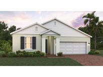 Charming single-story home featuring a two-car garage and well-manicured landscaping at 5850 Ali Grace Dr, St Cloud, FL 34771