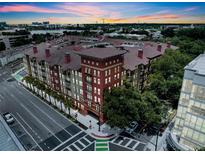 Stunning aerial view of the complex showcasing its unique architecture and vibrant surroundings at sunset at 911 N Orange Ave # 443, Orlando, FL 32801