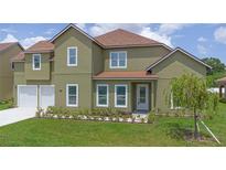 Charming two-story home features a manicured lawn and a two car attached garage at 1929 Sipes Ave, Sanford, FL 32771