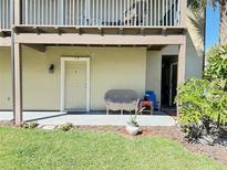 Inviting condo entrance with a cozy seating area and well-maintained landscaping at 249 Afton Sq # 112, Altamonte Springs, FL 32714