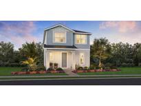 Charming two-story home with landscaped yard, covered porch, and craftsman details at 2552 Long Pine Ave, Apopka, FL 32712