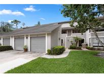 Inviting townhome with attached garage and landscaped front yard at 308 N Shadowbay Blvd # 214, Longwood, FL 32779