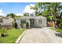 Charming single-story home featuring a concrete driveway and well-maintained lawn at 320 Eaton St, Maitland, FL 32751