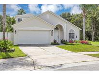 Charming single-story home boasts a well-manicured lawn, spacious driveway, and inviting front entrance at 3706 Andover Cay Blvd, Orlando, FL 32825