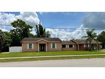 Charming single-story home featuring white-trimmed windows and a well-maintained lawn at 385 Lynchfield Ave, Altamonte Springs, FL 32714