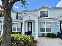 Charming two-story home with a well-maintained front yard and inviting entrance at 7682 Sir Kaufmann Ct, Kissimmee, FL 34747