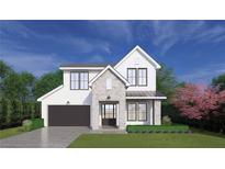 New two-story home with gray and white brick, black trim windows, gray roof, and a black two-car garage at 2215 Amherst Ave, Orlando, FL 32804