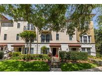 Charming multi-level townhome with well-maintained landscaping and a welcoming front entrance at 3508 Porta Romano Way, Lake Mary, FL 32746