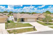 Charming single-Gathering home with a well-manicured lawn and attached two-car garage at 1166 Mapimi Ct, Winter Springs, FL 32708