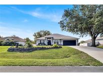 Charming single-story home with a well-manicured lawn and mature trees in a quiet residential neighborhood at 2919 Foraker Way, Kissimmee, FL 34758