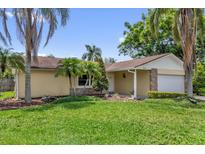 Inviting front yard with lush green grass and landscaping at 4959 Ardmore Dr, Winter Park, FL 32792