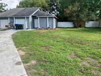 Charming single-story home with well-maintained lawn, garage, and inviting entrance at 7266 Oak Meadows Cir, Orlando, FL 32835
