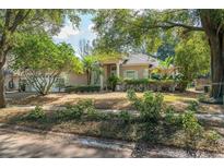Inviting single-story home with lush landscaping and a two-car garage in a desirable neighborhood at 7924 Bridgestone Dr, Orlando, FL 32835