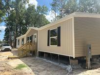Charming single-story home featuring a classic design and inviting front porch at 1349 Nw 109 Ave, Ocala, FL 34482