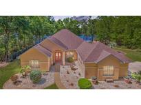 Charming single-story home with a manicured front yard and a welcoming entrance at 21795 Sw 88Th Lane Rd, Dunnellon, FL 34431