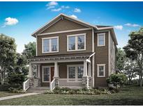 Charming two-story home showcasing a covered front porch and inviting curb appeal at 2486 Celebration Blvd, Celebration, FL 34747