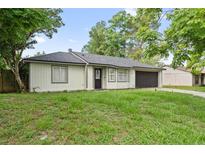 Charming single-story home with a well-maintained lawn and attached garage at 2753 Beckwith St, Deltona, FL 32738