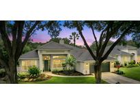 Beautiful single-Gathering home with a tile roof, well-manicured landscaping, and an attached two car garage at 387 Devon Pl, Lake Mary, FL 32746